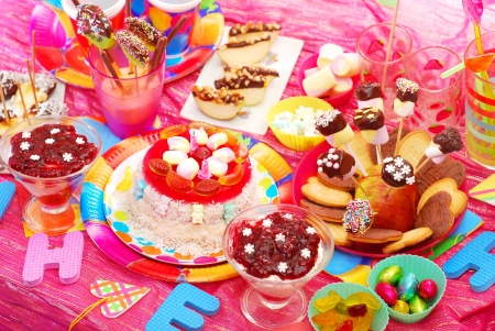 birthday party with homemade torte and fruit sweets for childrenの写真素材