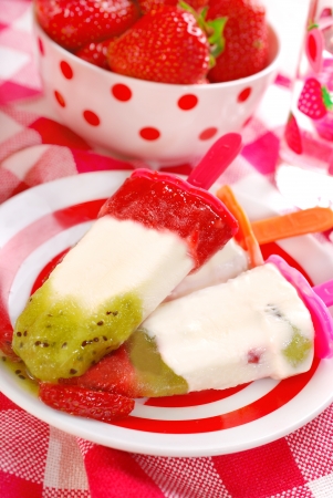 homemade strawberry , kiwi and coconut ice creams for childrenの写真素材