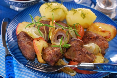 turkey liver fried with onion,apple and rosemary for dinnerの写真素材