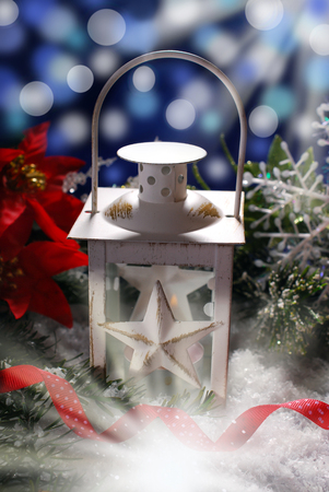 christmas decoration and burning vintage lantern in dark night の写真素材