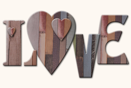 wooden letters with hearts isolated on white backgroundの写真素材