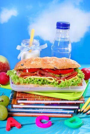healthy breakfast for school  with big ciabatta sandwich ,fresh fruits and drinkの写真素材