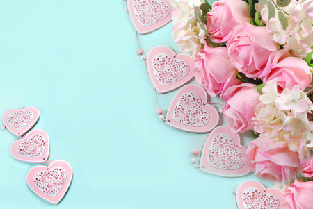 romantic love background in pastel colors with bunch of pink roses and heartsの写真素材