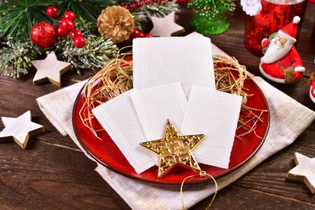 traditional christmas eve wafers on plate with hayの写真素材