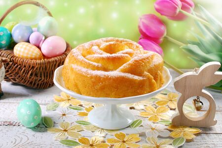 delicious easter cake in rose shape on festive tableの写真素材