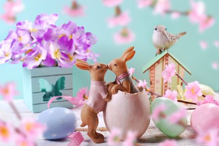 beautiful easter decoration with eggs,kissing rabbits and flowers in pastel colors