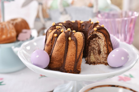 easter traditional marble ring cake with egg decorations  on festive table