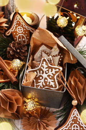 Christmas decorations and old metal box full of homemade gingerbread cookies