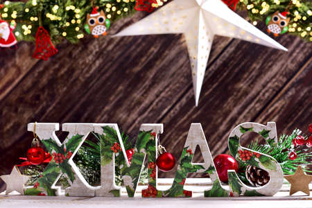 Christmas arrangement with decorative letters XMAS on wooden backgroundの写真素材