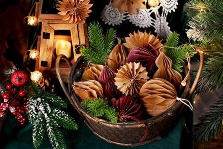Wicker basket full of DIY paper decors in two colors for Christmasの写真素材