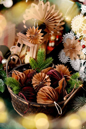 Wicker basket full of DIY paper decors in two colors for Christmasの写真素材