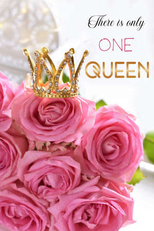 Diamond crown on bunch of pink roses with inscription There is only one queenの写真素材
