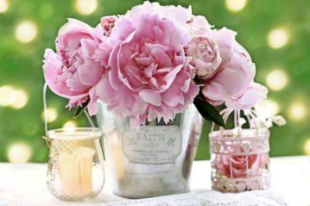 Romantic style still life with pink fresh peonies on the table in the gardenの写真素材