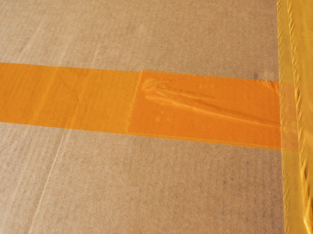 Brown corrugated cardboard parcel useful as a backgroundの写真素材