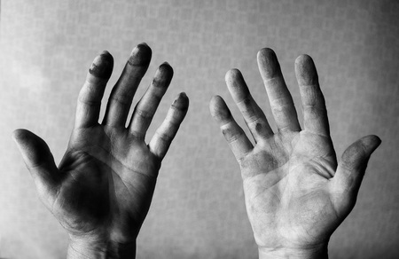 Mechanic with dirty hands after fixing a carの写真素材