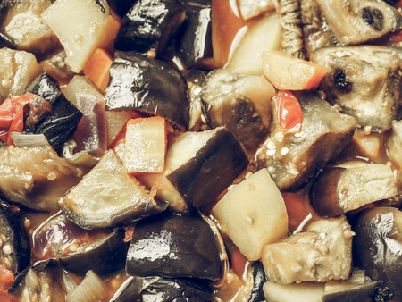 Vintage faded Aubergine (Solanum melongena) aka egg plant or melongene or garden egg vegetables with Tomato and carrots, vegetarian foodの写真素材