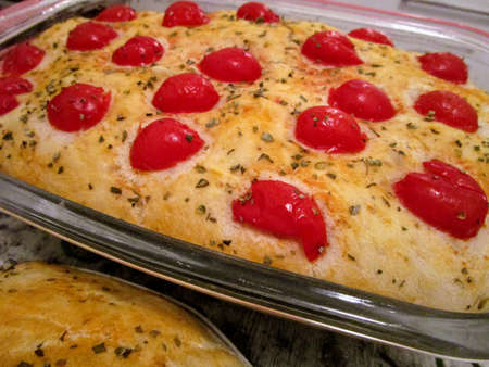 Homemade focaccia with cherry tomato and oregano.の写真素材