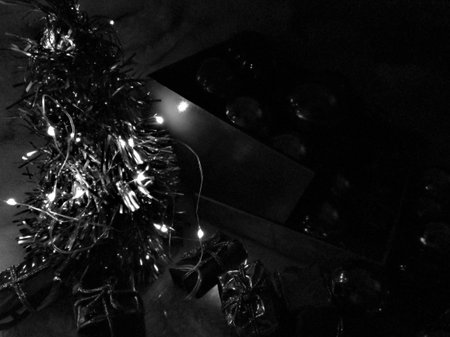 christmas decoration in black and white with garland and lights.の写真素材