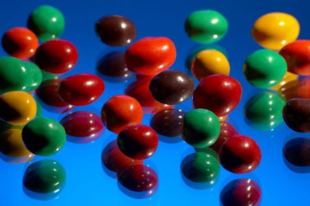 Multi-coloured sweets on a dark blue background