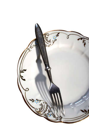 Plate and fork on a white backgroundの写真素材