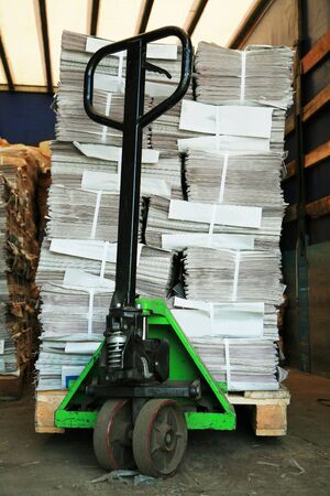 green manual carriage with a paper in a warehouseの写真素材