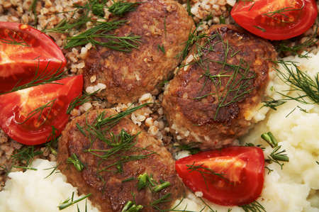 Meat cutlets, buckwheat boiled and mashed potatoesの写真素材