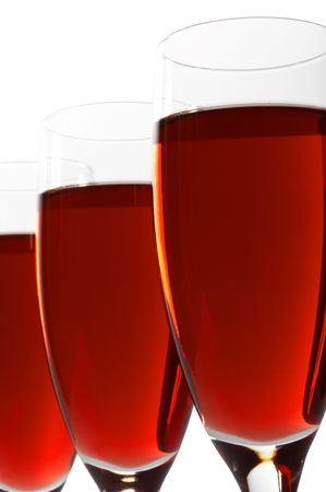 Three glasses with red wine on a white backgroundの写真素材
