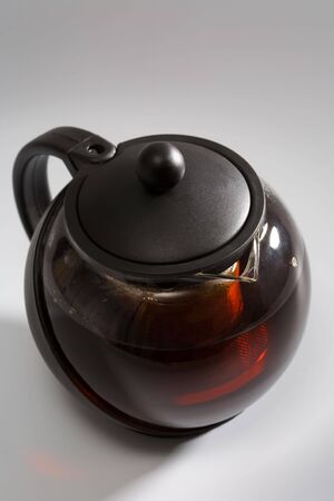 Strong black tea in a fashionable teapot の写真素材