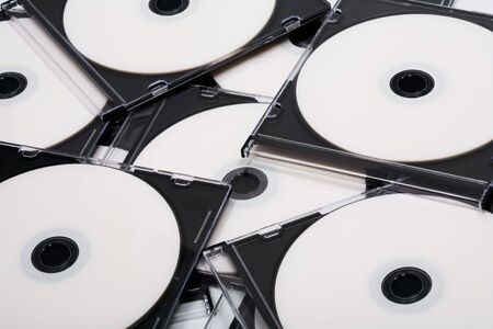 Disks cd in boxes as a backgroundの写真素材