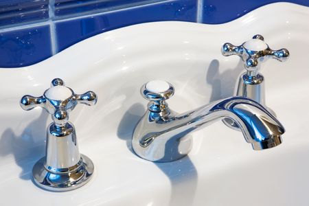 The beautiful and shining tap in a modern bathroom