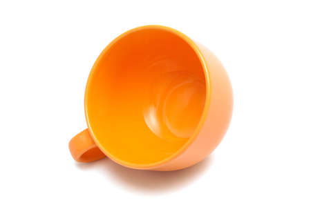 Beautiful orange cup on a white backgroundの写真素材