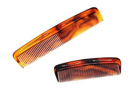 two beautiful hairbrushes on a white backgroundの写真素材