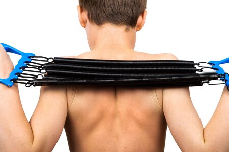 the boy with the expander on a white backgroundの写真素材