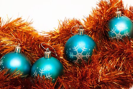 blue Christmas balls on the orange garlandの写真素材