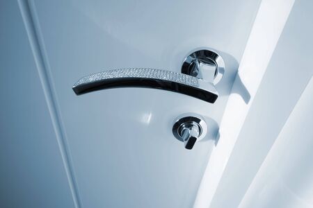 white door with the new metal handleの写真素材