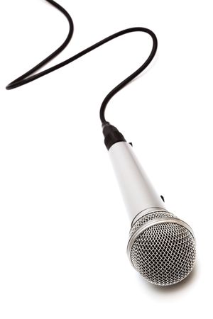 Microphone with a black cord on a white backgroundの写真素材