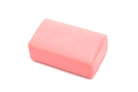 a piece of pink soap on a white background