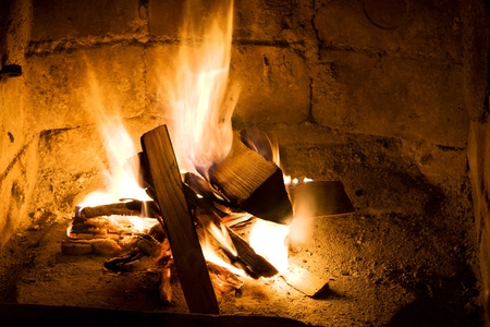 burning wood in a fireplace close upの写真素材