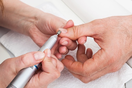 Manicure man close-up to the beauty salonの写真素材