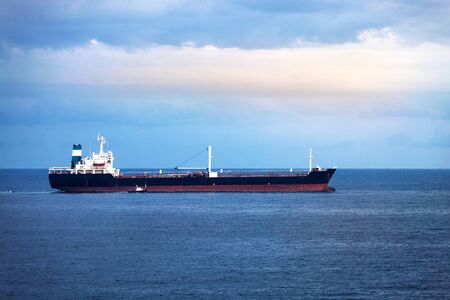 cargo ship in the ocean in the skyの写真素材