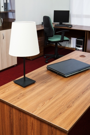 New laptop on a desk at modern officeの写真素材