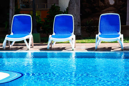 lounge chairs by the poolの写真素材