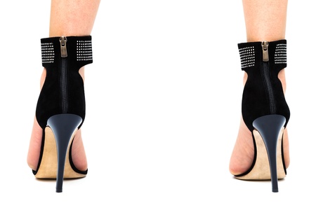 woman in high heels on a white backgroundの写真素材