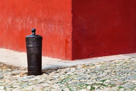 red wall and a gun in the old townの写真素材