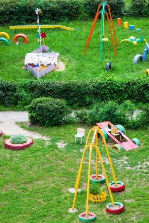 playground for children in the garden on a sunny dayの写真素材