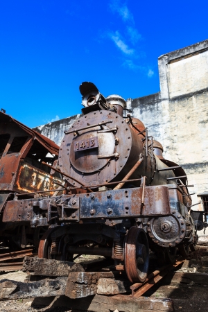 old rusty steam locomotive in background of the skyのeditorial素材