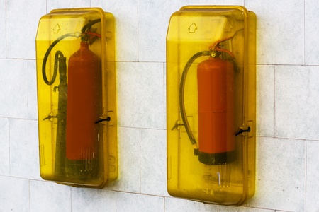 red fire extinguisher on the wallの写真素材