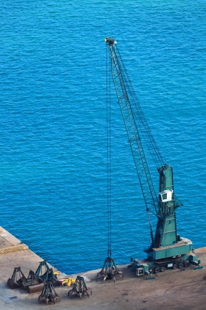 modern dredge in the harbor on a sunny dayの写真素材