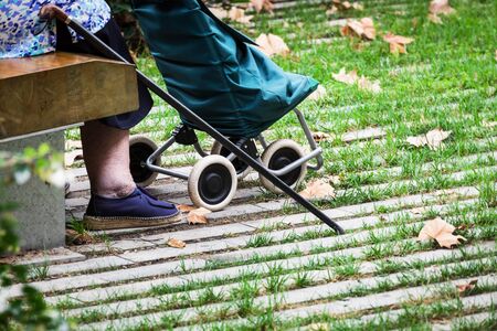 an old woman on a park benchの写真素材