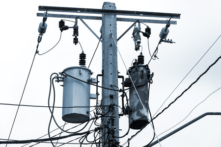 old reinforced concrete pole with electrical wires